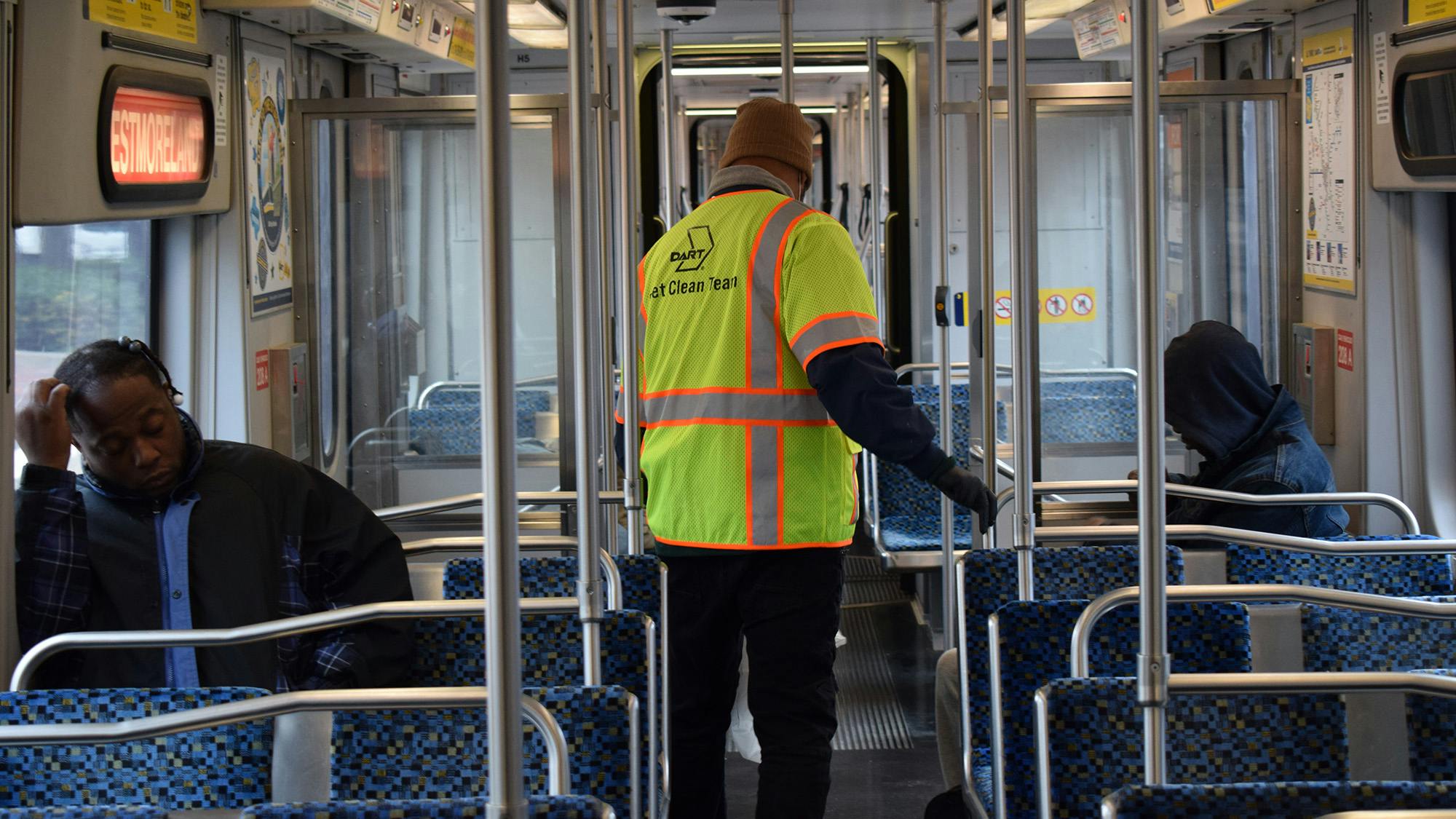 A Dallas Area Rapid Transit Clean Team member on a light-rail train.