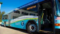 A TART bus sits with its door open. A TART bus sits with its door open.