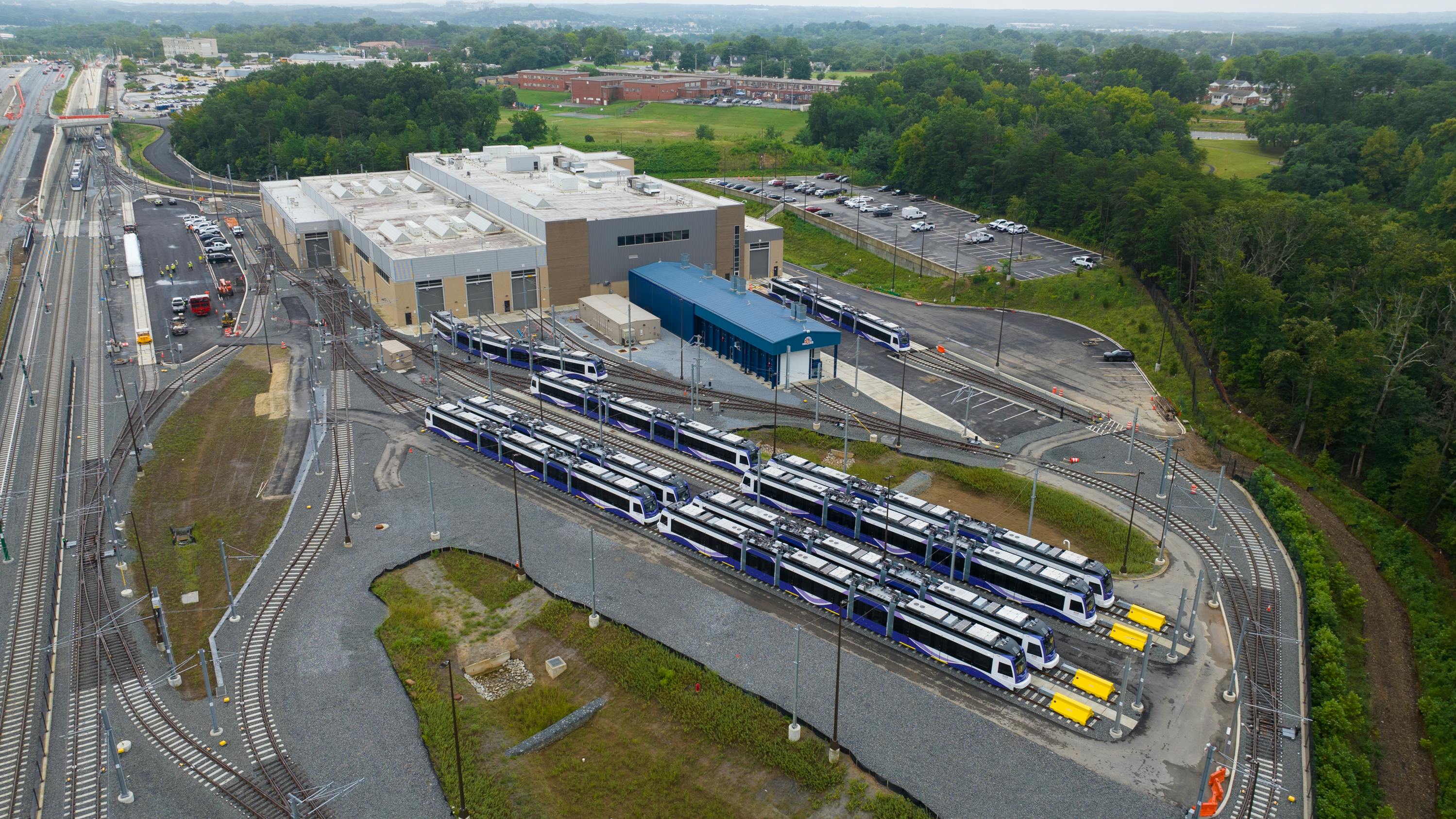 The image shows an aerial view of the LRVs in a yard.