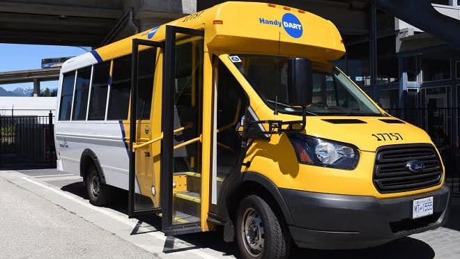 A HandyDART bus sits with its door open.