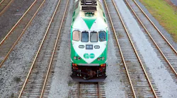 A GO Transit train moves down the track. A GO Transit train moves down the track.