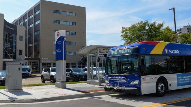A Metro Transit bus approaches a stop.