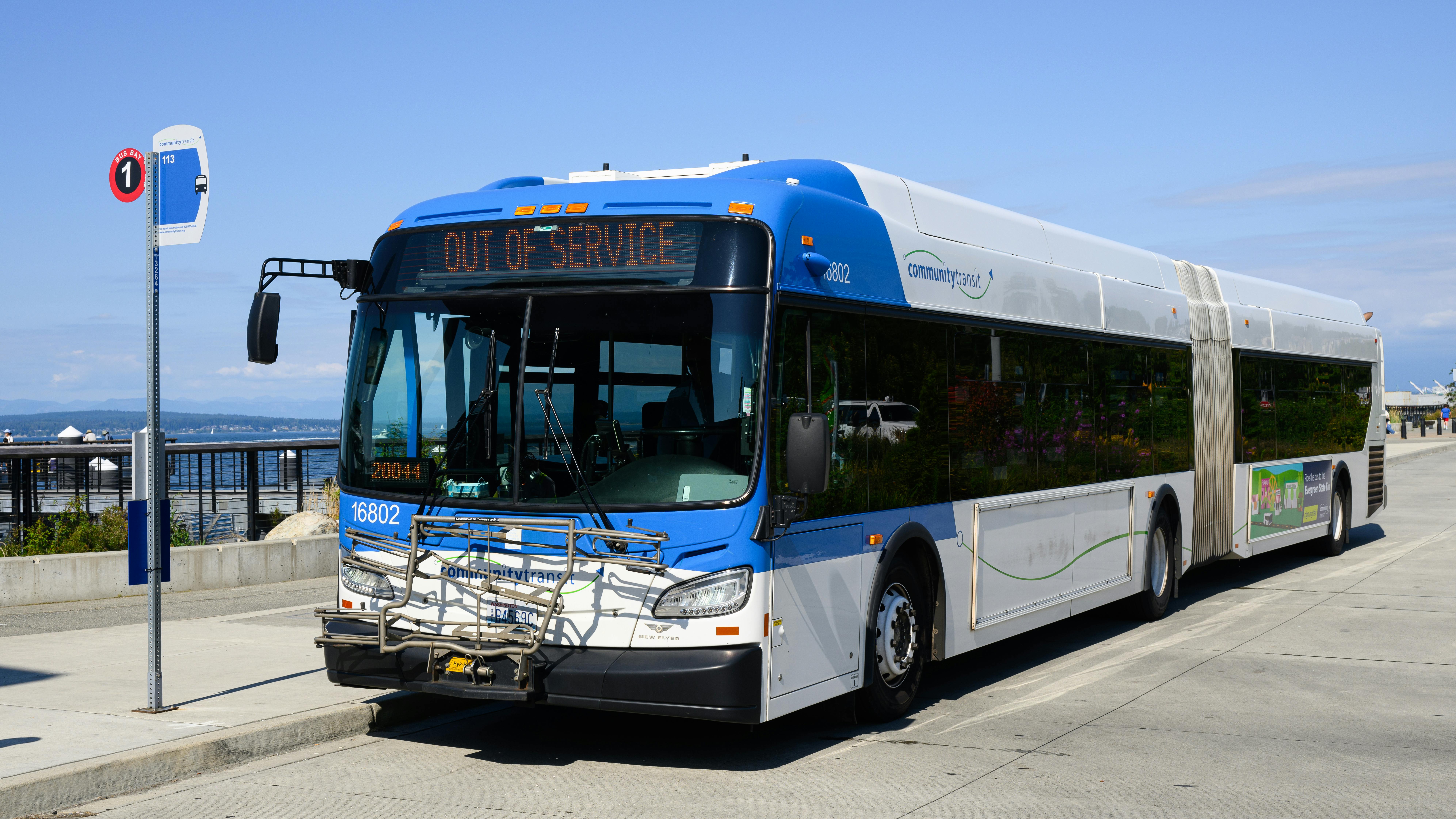 A Community Transit bus sits at a stop.