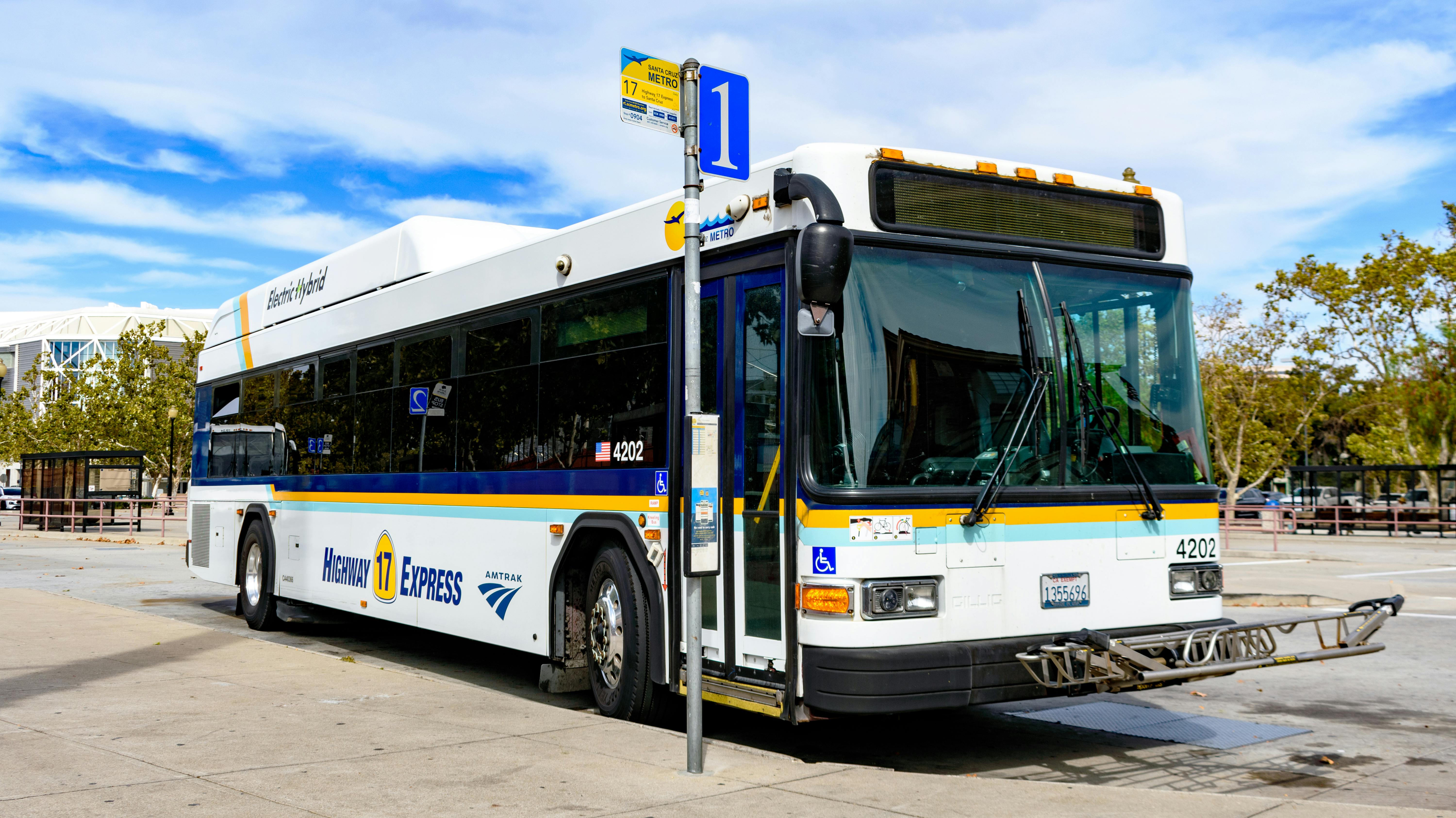 A bus sits at a San Jose stop.