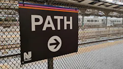 The image displays a sign for PATH train service. The image displays a sign for PATH train service.