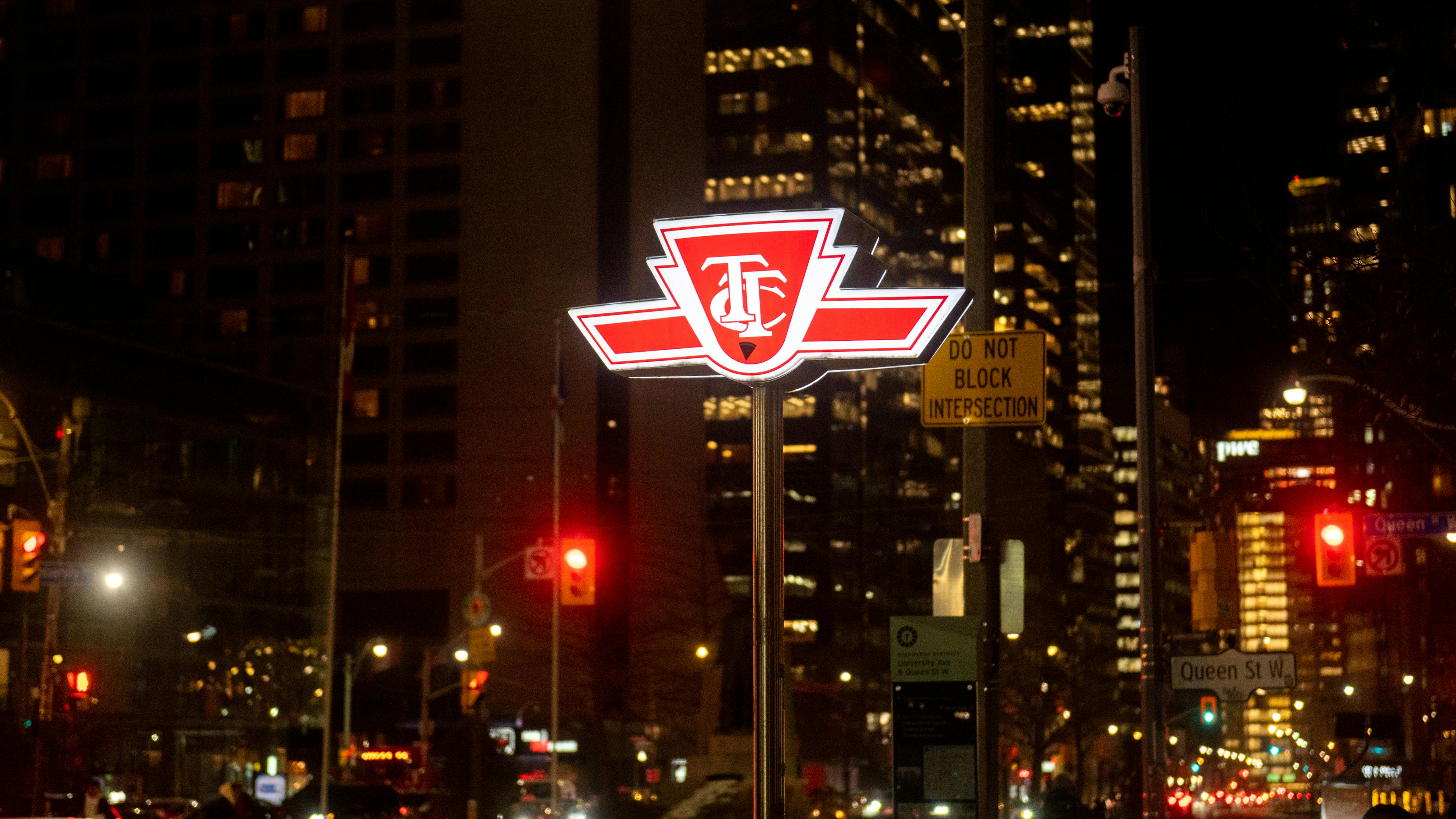 A TTC sign shines at night.