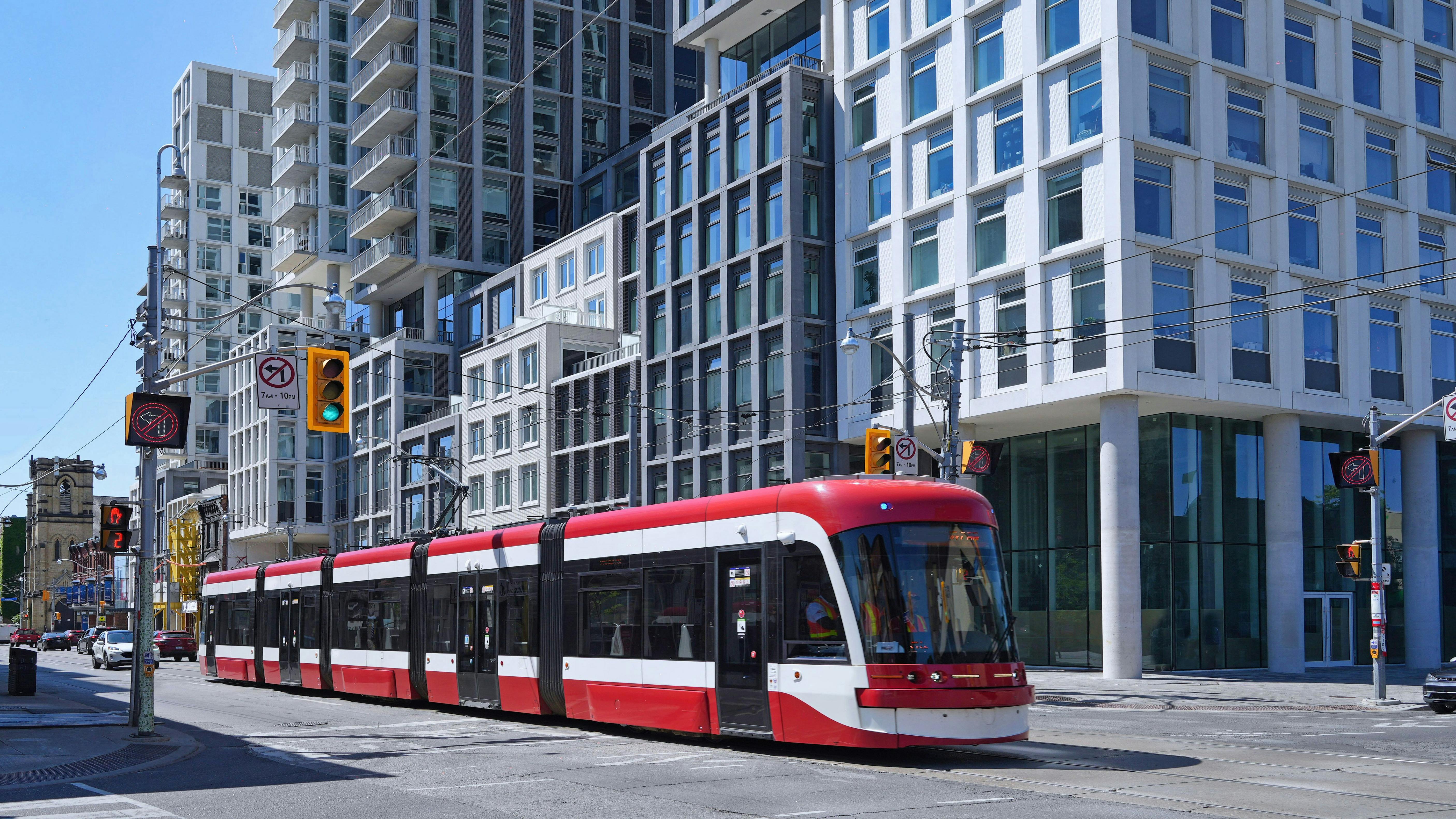 A new streetcar rolls down the tracks.