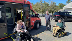 A rider getting off a miniMeVa van. A rider getting off a miniMeVa van.