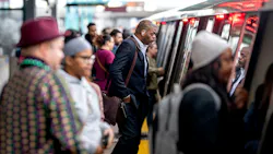 Passengers board a rail car. Passengers board a rail car.