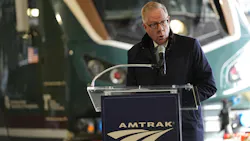 A transit leader delivers remarks in front of the new Airo train. A transit leader delivers remarks in front of the new Airo train.