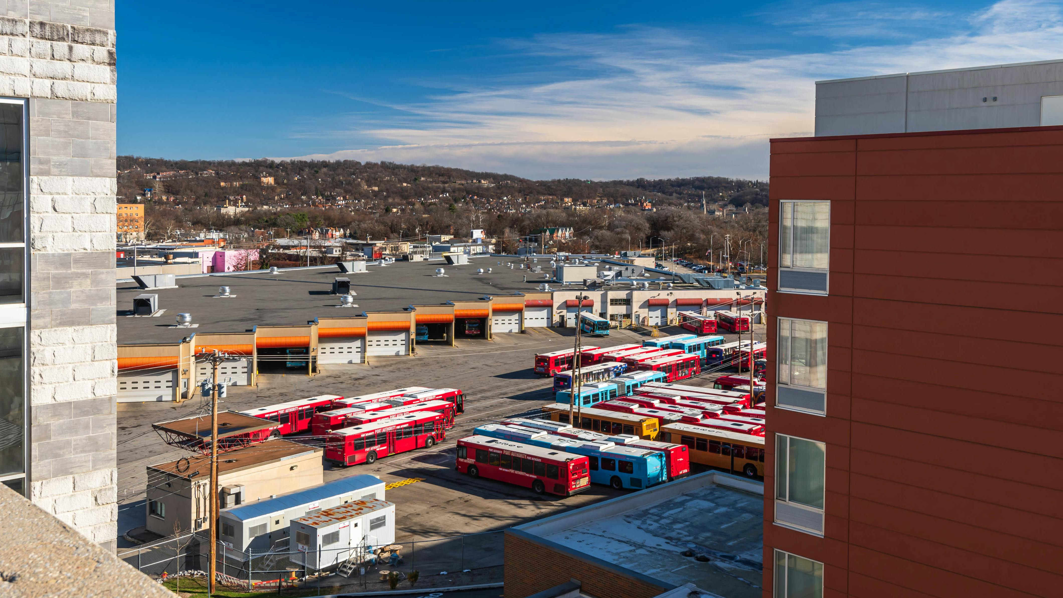 The image shows an aeriel view of a depot lot of parked PRT buses.