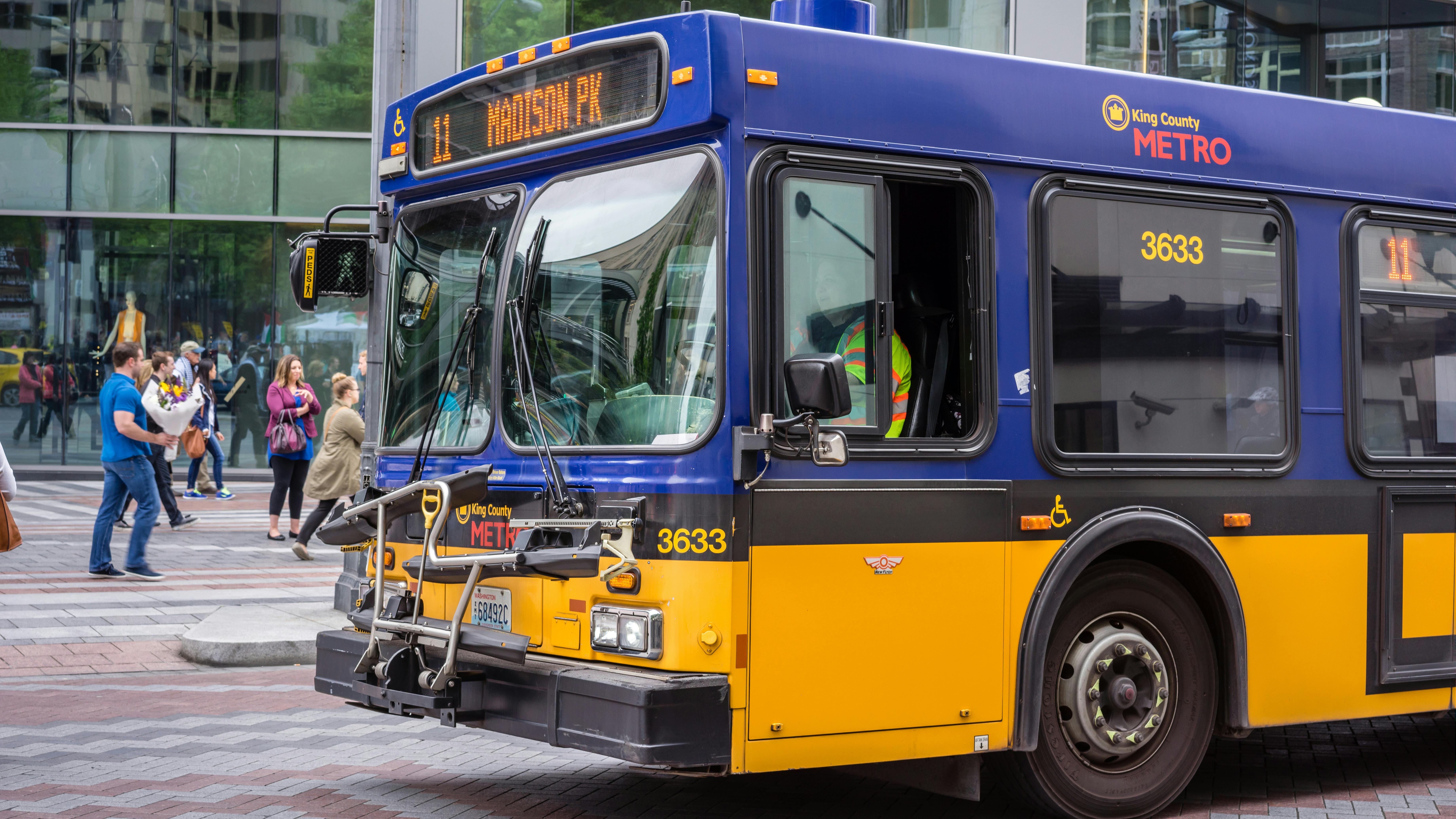 A King County Metro bus moves down a street.