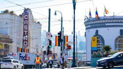 The image shows an intersection hosting a new set of signage. The image shows an intersection hosting a new set of signage.