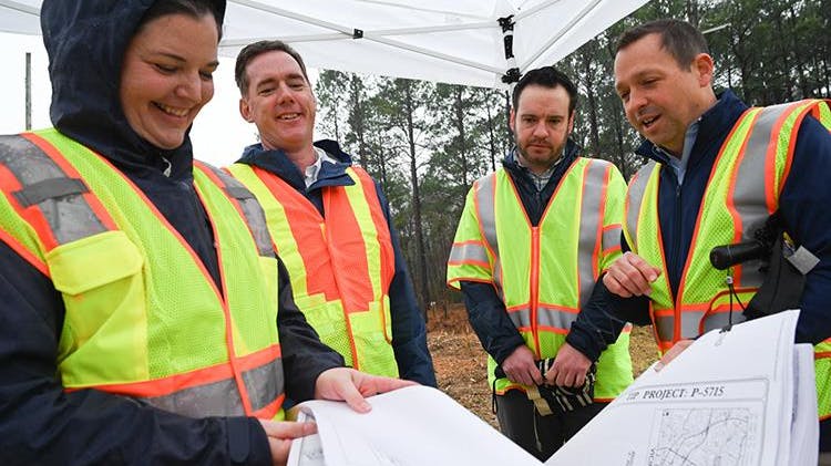 From left to right: North Carolina Department of Transportation (NCDOT) Division 5 Engineer Becca Gallas, NCDOT Secretary Daniel Johnson, Federal Railroad Administration Deputy Administrator Drew Feeley and NCDOT Rail Division Director Jason Orthner reviewed plans for the S‑Line grade separation project on New Hope Church Road in Raleigh, N.C., on Feb. 26.&NegativeMediumSpace;&NegativeMediumSpace;&NegativeMediumSpace;