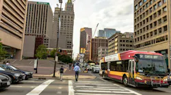 Traffic and pedestrians in downtown Baltimore near the city center. Traffic and pedestrians in downtown Baltimore near the city center.
