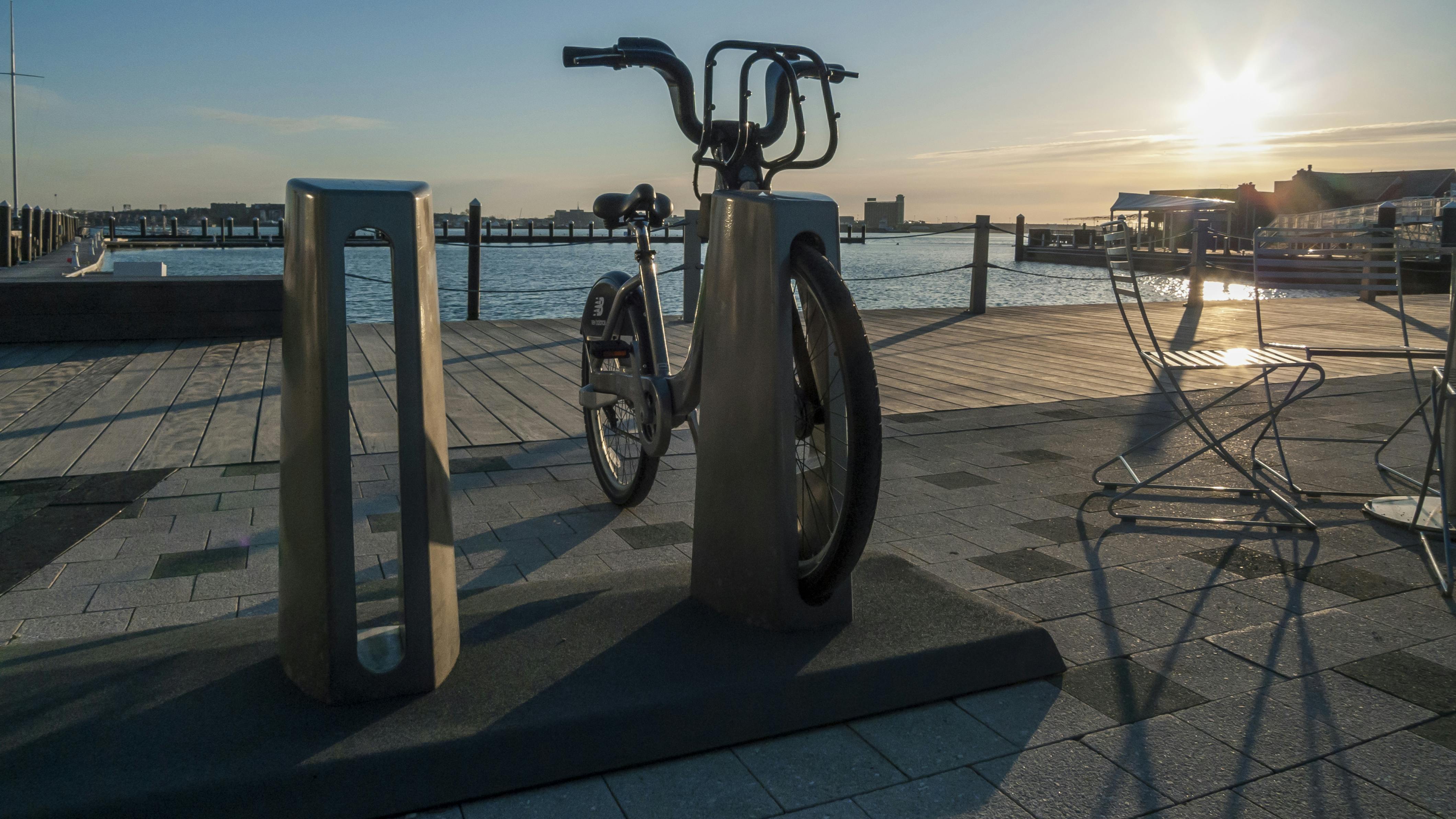 A Hubway bike sits docked in a station.
