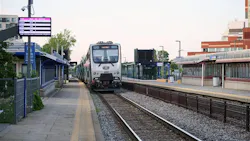 An exo trains sits at a station. An exo trains sits at a station.