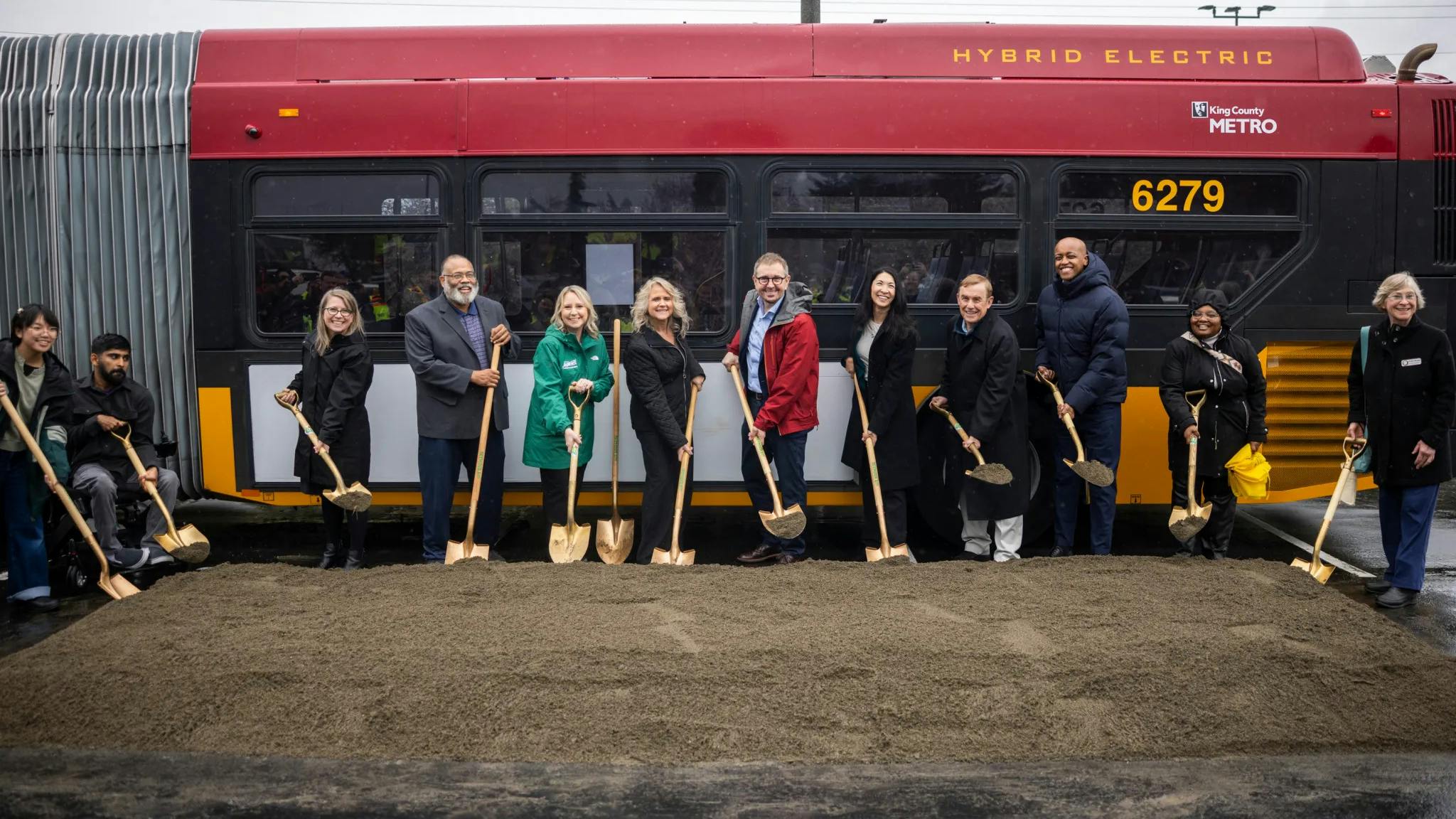 From left to right: Community members Arya Nguyen and Prem Subedi, King County Metro General Manager Michelle Allison, State Rep. David Hackney (D-WA-11), Auburn Deputy Mayor Tracy Taylor, Kent Mayor Dana Ralph, Renton Mayor Armondo Pavone, King County Councilmembers Steffani Fain and Peter von Reichbauer, King County Executive Girmay Zahilay, State Rep. Debra Entenman (D-WA-47), Renton Councilmember Valerie O&rsquo;Halloran.