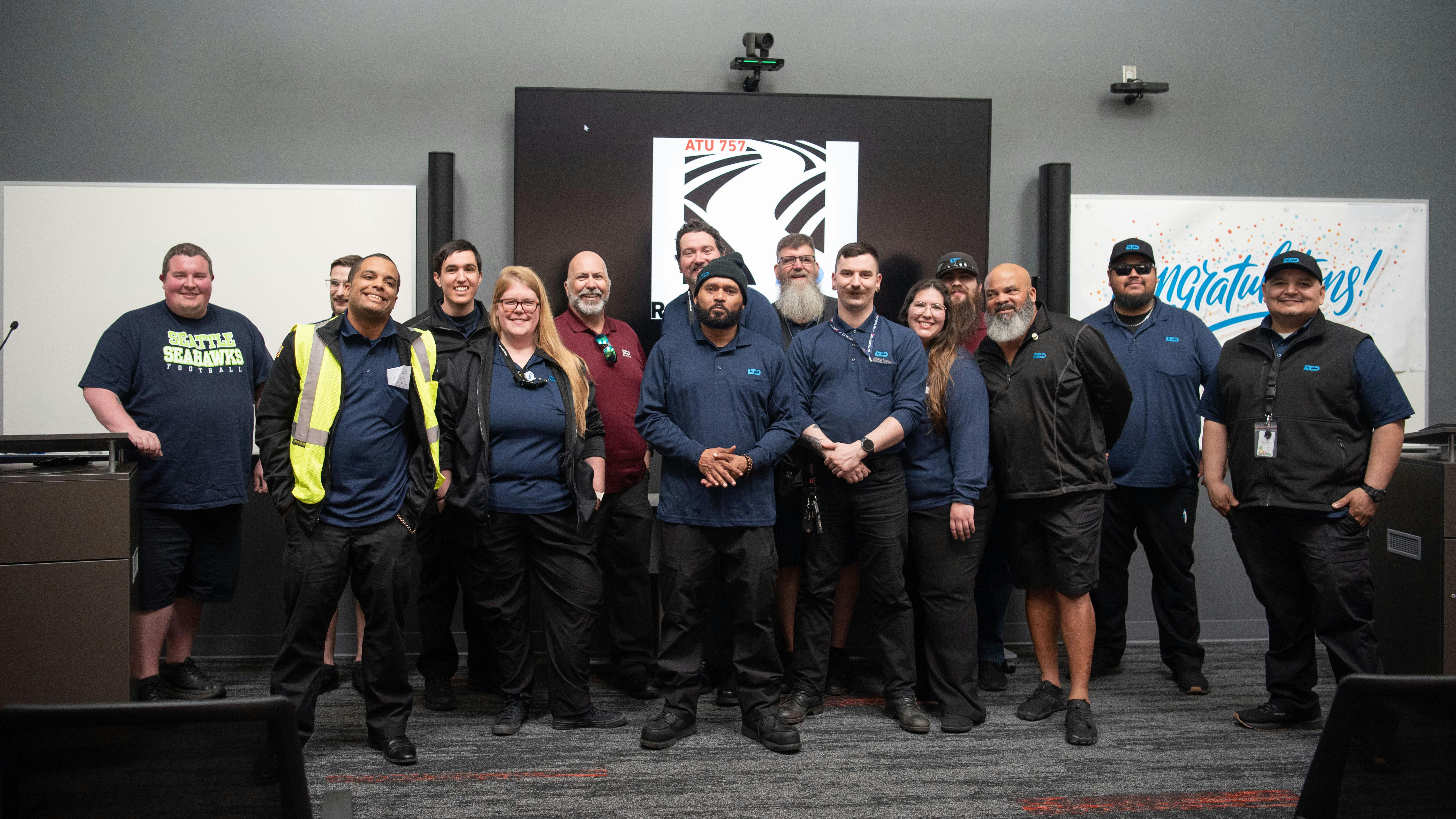Lane Transit District's new apprenticeship class stands posed with their mentors.
