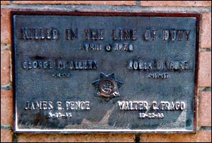 The plaque on the monument to the four CHP officers killed in the Newhall Incident.