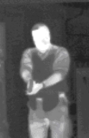 With a TI, we can plainly see that this person is holding a gun in a combat grip and is wearing soft body armor (SBA). SBA can be seen, whether concealed or not, because it interferes with the thermal signature of the person's body heat.