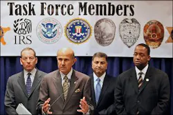 Law enforcement officials take questions on a federal racketeering indictment that accuses members of the Armenian Power gang of a range of offenses. Law enforcement officials take questions on a federal racketeering indictment that accuses members of the Armenian Power gang of a range of offenses.