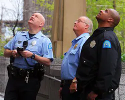 Police look up at a rope that is hanging out of a broken window on the second-floor of the St. Louis Justice Center in downtown St. Louis on Friday, April 22, 2011 in St. Louis. Police look up at a rope that is hanging out of a broken window on the second-floor of the St. Louis Justice Center in downtown St. Louis on Friday, April 22, 2011 in St. Louis.