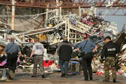 Police officers walk in to the back of a destroyed Wal-Mart store in Joplin, Mo. Police officers walk in to the back of a destroyed Wal-Mart store in Joplin, Mo.