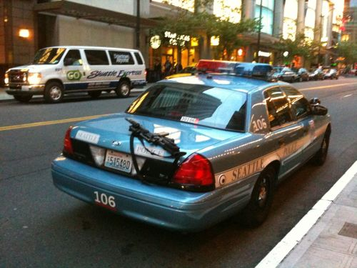A passerby snapped a shot of an AR-15 rifle on the trunk of an unattended cruiser parked on a city street.