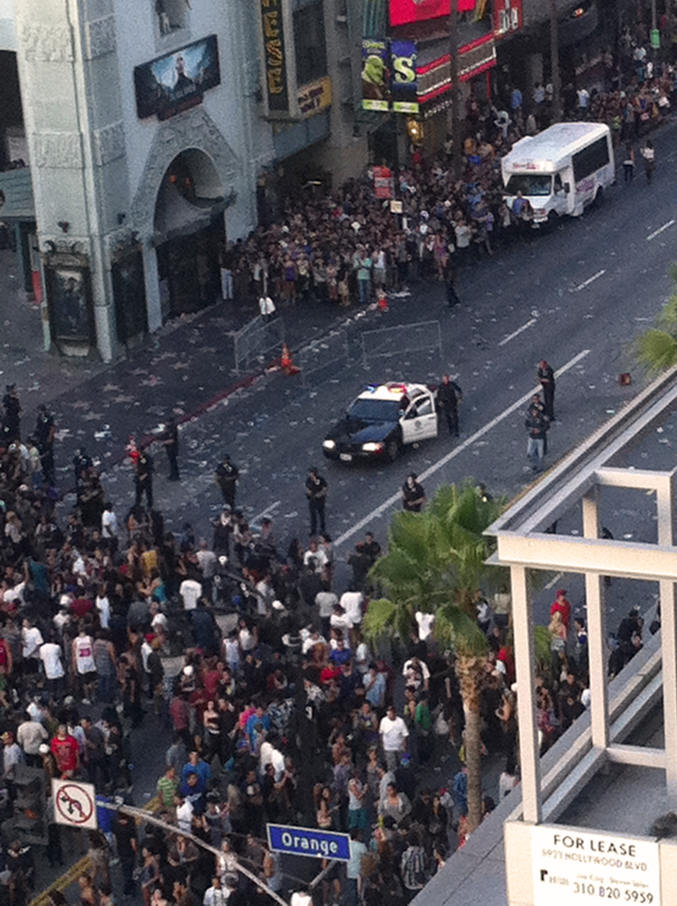 Police hold back a crowd outside Grauman's Chinese Theater in the Hollywood section of Los Angeles.