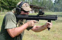 The author operates the Kel-Tec KSG 12 gauge shotgun. (note bottom ejected shell) The author operates the Kel-Tec KSG 12 gauge shotgun. (note bottom ejected shell)