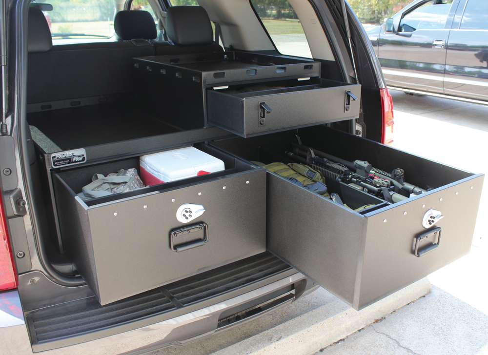 SUV outfitted with law enforcement weapons and gear in Hitec compartments