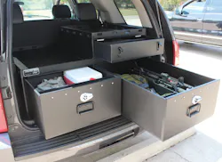 SUV outfitted with law enforcement weapons and gear in Hitec compartments SUV outfitted with law enforcement weapons and gear in Hitec compartments