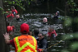 Houston police marine unit divers search for 2-year-old Devin Davis in a creek next to his home on Wednesday, March 28, 2012, in Cleveland, Texas. Houston police marine unit divers search for 2-year-old Devin Davis in a creek next to his home on Wednesday, March 28, 2012, in Cleveland, Texas.