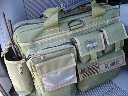 Shown mounted in patrol passenger seat, closed. What's inside?