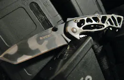 Buck Knives Small Bones Knife on vest Buck Knives Small Bones Knife on vest