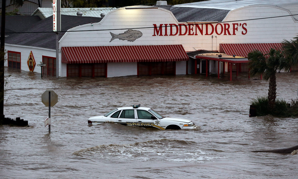 A sheriff's vehicle sits in flood waters caused by Isaac, Thursday, Aug. 30, 2012, north of LaPlace, La, off Lake Pontchartrain. Isaac's maximum sustained winds had decreased to 45 mph and the National Hurricane Center said it was expected to become a tropical depression by Thursday night. The storm's center was on track to cross Arkansas on Friday and southern Missouri on Friday night, spreading rain as it goes.