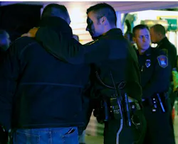 Law enforcement officers console each other as they looked in on the hearse carrying the body of fallen Officer Tom Decker at Wenners Funeral home in Cold Spring, Minn. on Nov. 30. Law enforcement officers console each other as they looked in on the hearse carrying the body of fallen Officer Tom Decker at Wenners Funeral home in Cold Spring, Minn. on Nov. 30.