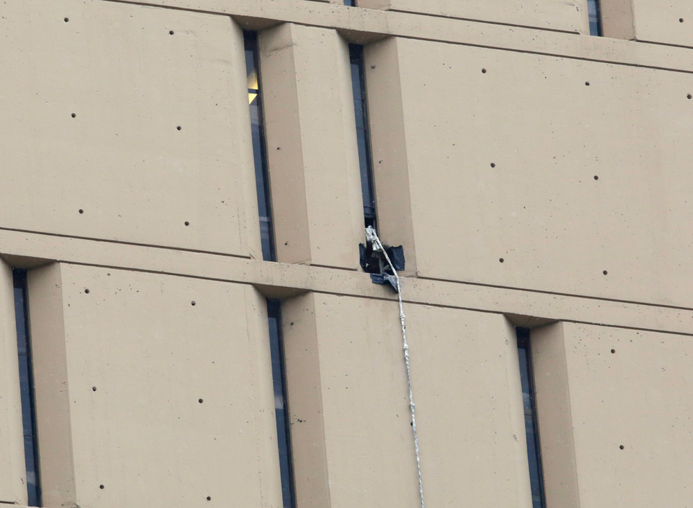 A rope dangles from a window on the back side of the Metropolitan Correctional Center on Dec. 18 in Chicago.