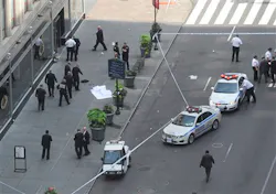 Police surround a sheet covered body on a Fifth Avenue sidewalk as they investigate a multiple shooting outside the Empire State Building in New York on Aug. 24, 2012. Police surround a sheet covered body on a Fifth Avenue sidewalk as they investigate a multiple shooting outside the Empire State Building in New York on Aug. 24, 2012.