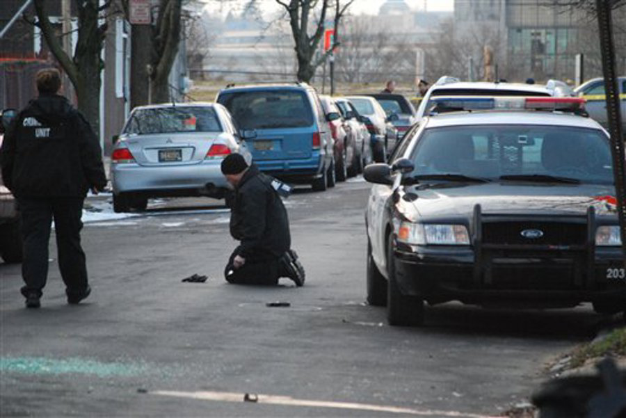 Authorities investigate a shooting where a police officer was wounded in the Southbridge section of Wilmington on Feb. 3.