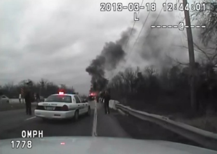 The Prince George's County police officer was attempting to remove the victim when the vehicle suddenly burst into flames on March 18.