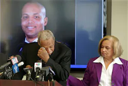 Carolyn Wortham comforts her husband Thomas Wortham III, as he speaks of their late son, Chicago Police Officer Thomas Wortham IV, during a news conference on April 24. Carolyn Wortham comforts her husband Thomas Wortham III, as he speaks of their late son, Chicago Police Officer Thomas Wortham IV, during a news conference on April 24.