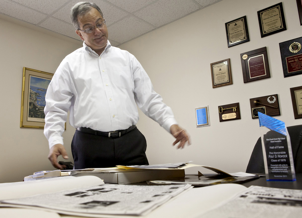 Paul Novack looks through boxes of files he has compiled in researching the 47-year-old kidnapping case of Danny Goldman, in his office in North Miami, Florida, on March 26.