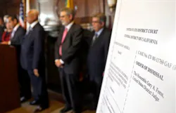 An poster with an enlarged view of the dismissal of the 2001 Los Angeles Police Department consent decree is seen as the mayor, police chief, and police commission board members appear at police headquarters on May 16. An poster with an enlarged view of the dismissal of the 2001 Los Angeles Police Department consent decree is seen as the mayor, police chief, and police commission board members appear at police headquarters on May 16.