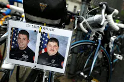 Photos of fallen Nassau County Police Officers Arthur Lopez, left, and Joseph Olivieri -- both killed in the line of duty in separate incidents in October 2012 -- are seen hanging from the seat of a bicycle during a stop along the Police Unity Tour bike ride on May 9. (AP Photo/Julio Cortez) Photos of fallen Nassau County Police Officers Arthur Lopez, left, and Joseph Olivieri -- both killed in the line of duty in separate incidents in October 2012 -- are seen hanging from the seat of a bicycle during a stop along the Police Unity Tour bike ride on May 9. (AP Photo/Julio Cortez)