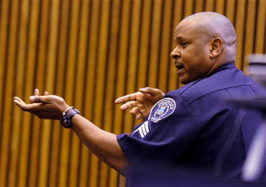 Detroit Sgt. Anthony Potts shows the way to use two hands in holding the MP-5, which is the weapon Officer Joseph Weekley used in the raid of the home where Aiyana Stanley-Jones was killed.