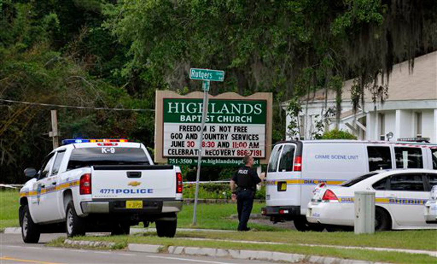 Police gather at the Highlands Baptist Church in Jacksonville, Fla. on June 22 where authorities said the body of 8-year-old Charish Perriwinkle was found.
