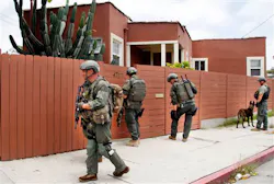 Los Angeles Sheriff's deputies search a city street for suspects after two police officers were shot and wounded in an attack outside a police station in the Mid-City area of Los Angeles on June 25. Los Angeles Sheriff's deputies search a city street for suspects after two police officers were shot and wounded in an attack outside a police station in the Mid-City area of Los Angeles on June 25.