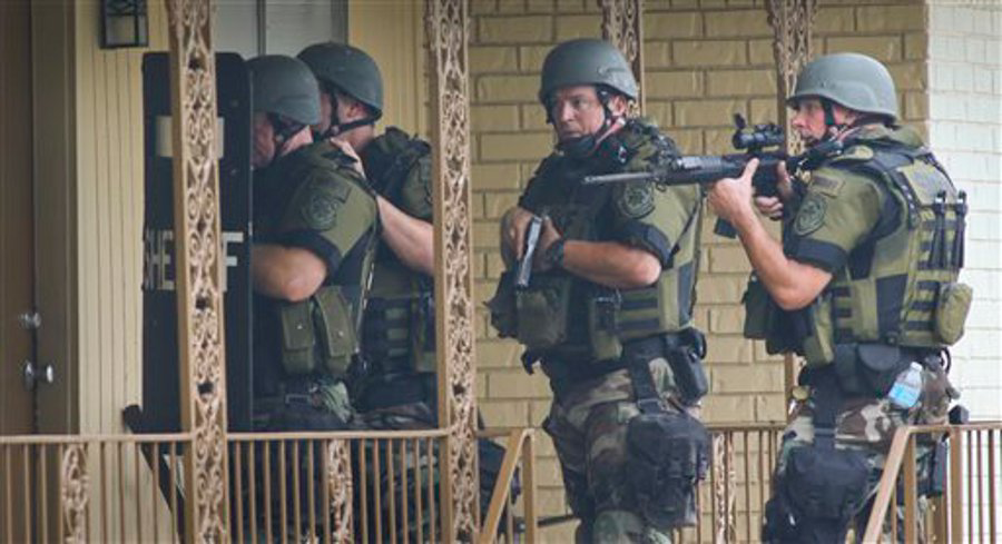 Cobb County Sheriff SWAT officers make entries into empty units at the Concord Chase apartment complex near Smyrna, Ga. on July 12.